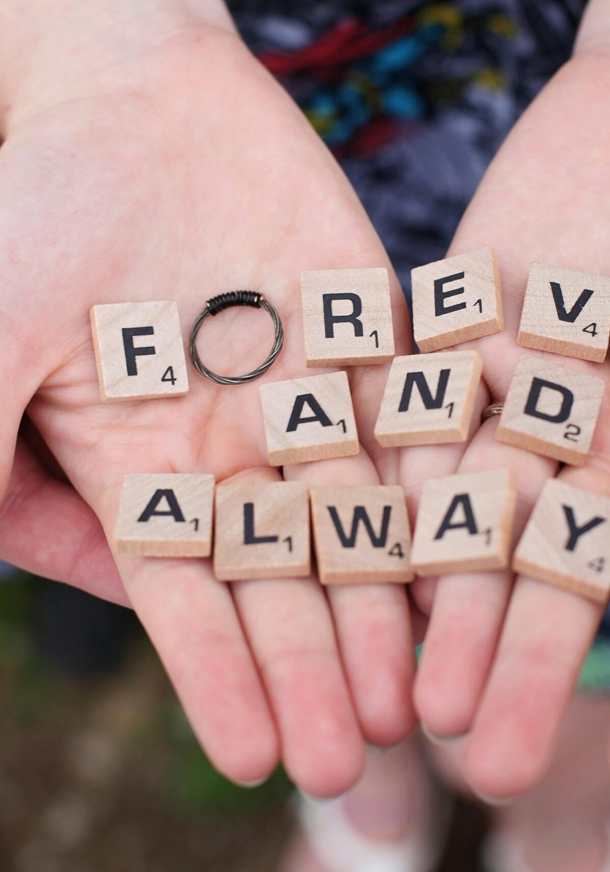 pexels-photo-540528-540528 Hands holding 'forever and always' in Scrabble letters, symbolizing eternal love.